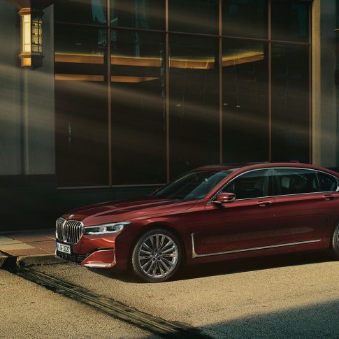 BMW Individual 7 Series Saloon, side view BMW Individual 7 Series Saloon in red in side view in front of urban setting