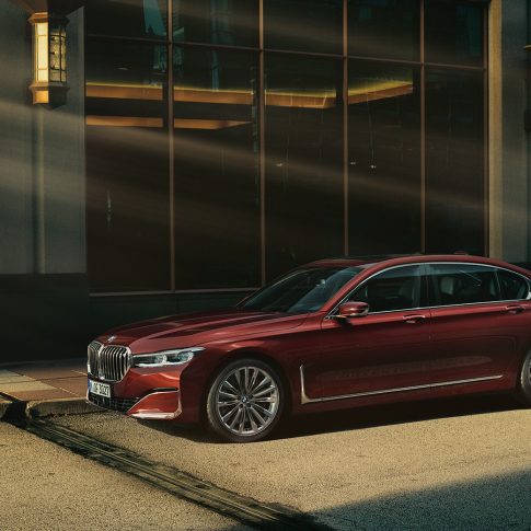 BMW Individual 7 Series Saloon, side view BMW Individual 7 Series Saloon in red in side view in front of urban setting