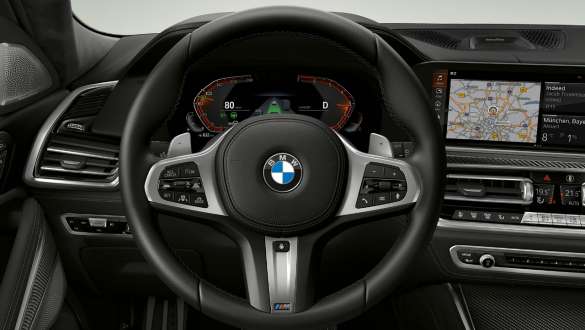 BMW X6 M50i Interior M leather steering wheel Close-up BMW X6 M50i M50d G06 SUV interior M leather steering wheel