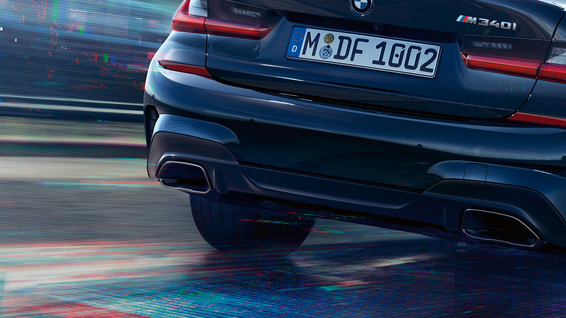 BMW 3 Series Saloon, M tailpipes. Close-up of the rear of the BMW 3 Series Saloon with M specific tailpipes in Cerium grey metallic.