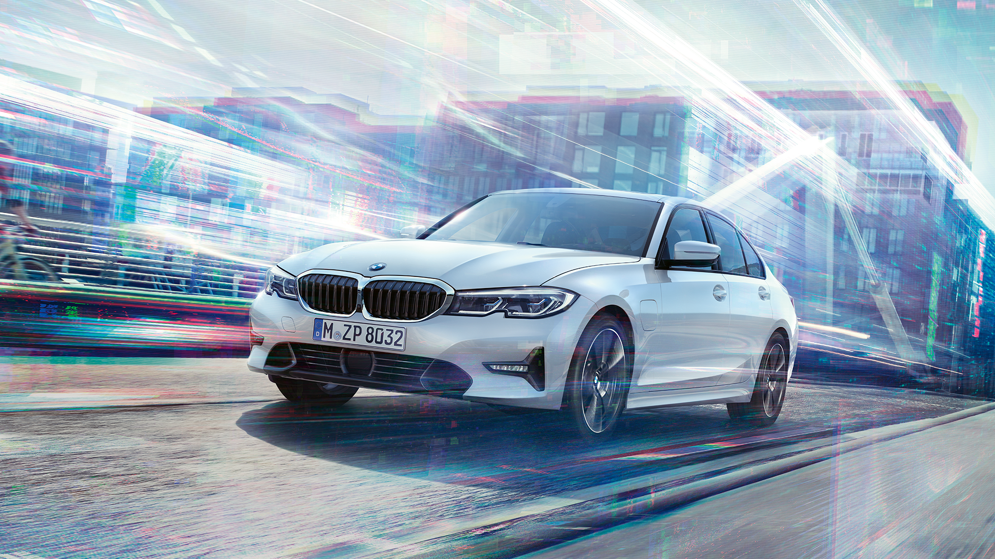 BMW 3 Series Saloon, driving 330e. BMW 3 Series Saloon 330e driving against an urban backround.