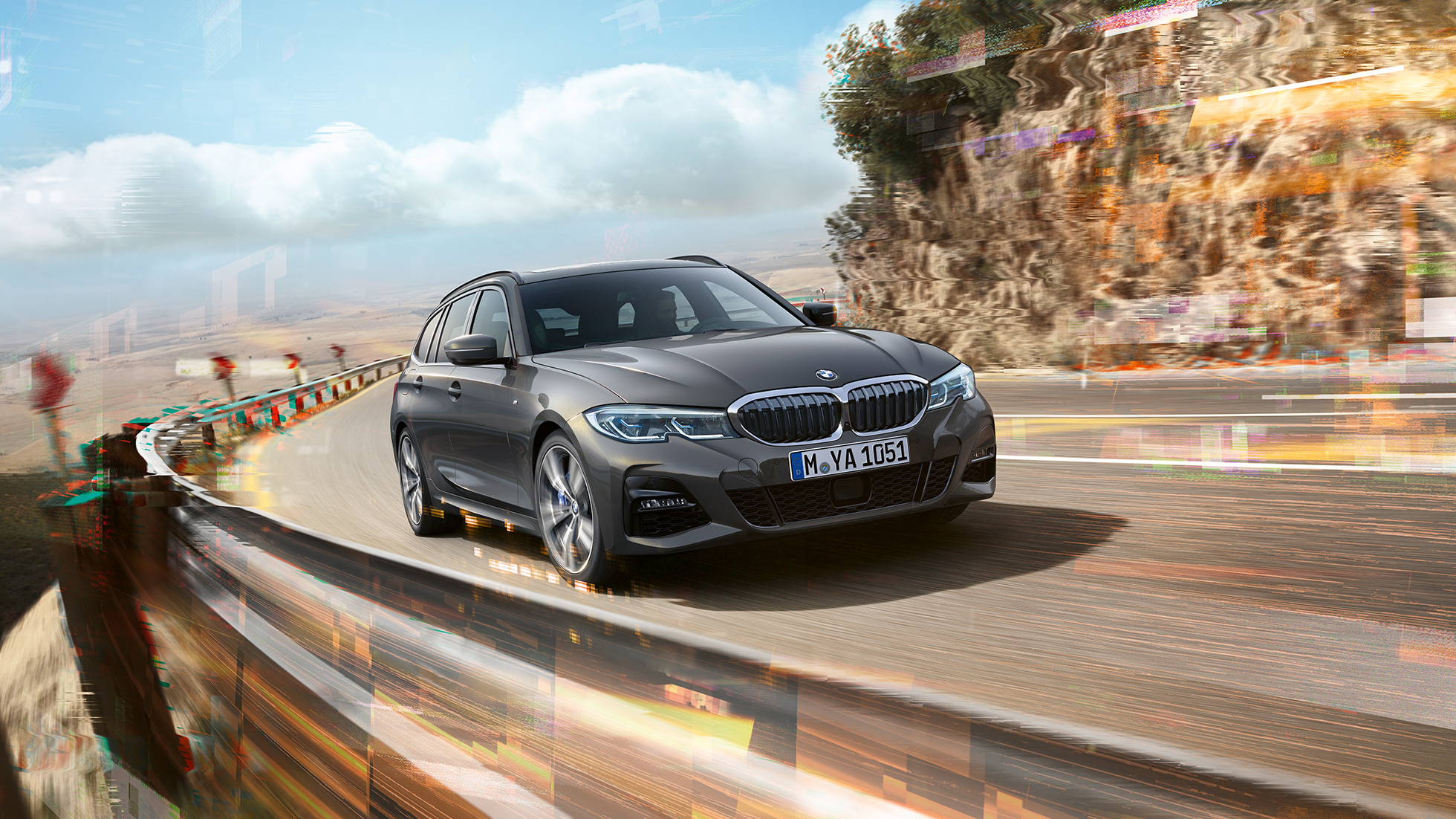 BMW 3er Touring, three-quarter front shot design BMW 3er Touring, three-quarter front shot driving on bridge in front of rural surroundings