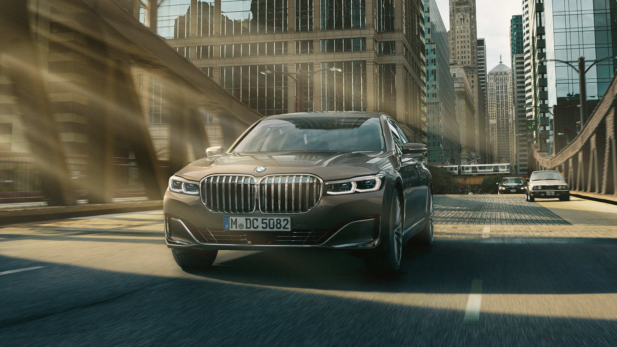 BMW 7 Series Saloon Driving Assistance Systems Driving Assistance Systems: BMW 7 Series Saloon driving in front of urban setting