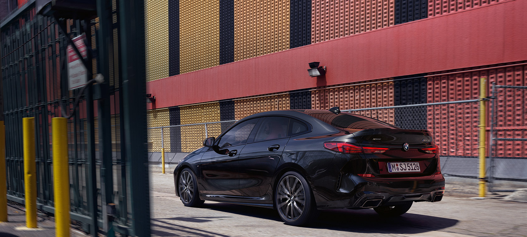 BMW M235i xDrive Gran Coupé three-quarter side view BMW M235i xDrive Gran Coupé Black Sapphire metallic F44 three-quarter side view