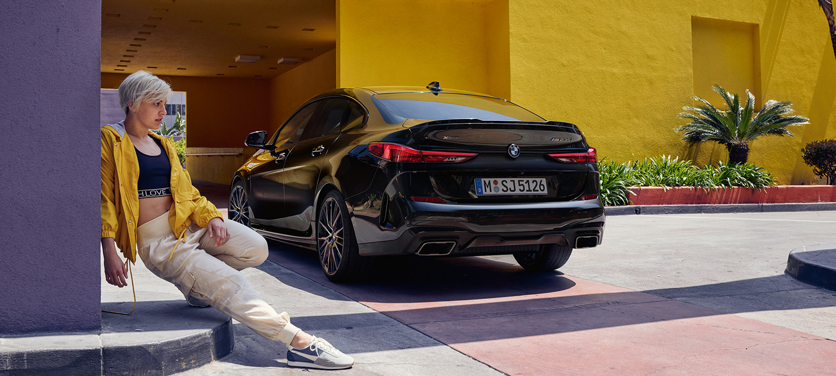 BMW M235i xDrive Gran Coupé three-quarter rear view BMW M235i xDrive Gran Coupé Black Sapphire metallic F44 three-quarter rear view