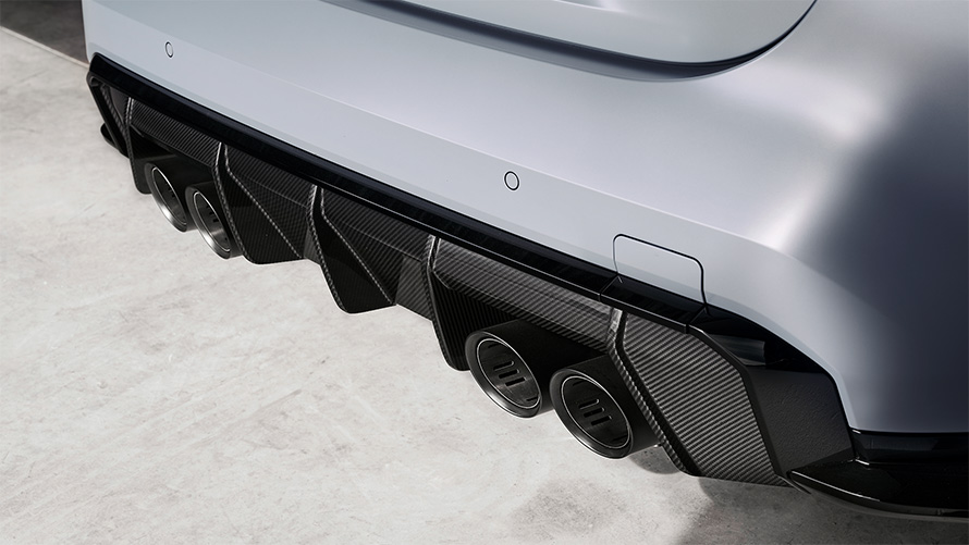 Titanium exhaust system with tailpipes in Black matt BMW M4 CSL G82 BMW M4 CSL G82 BMW Individual Frozen Brooklyn Grey metallic Titanium exhaust system with tailpipes in Black matt close-up rear view