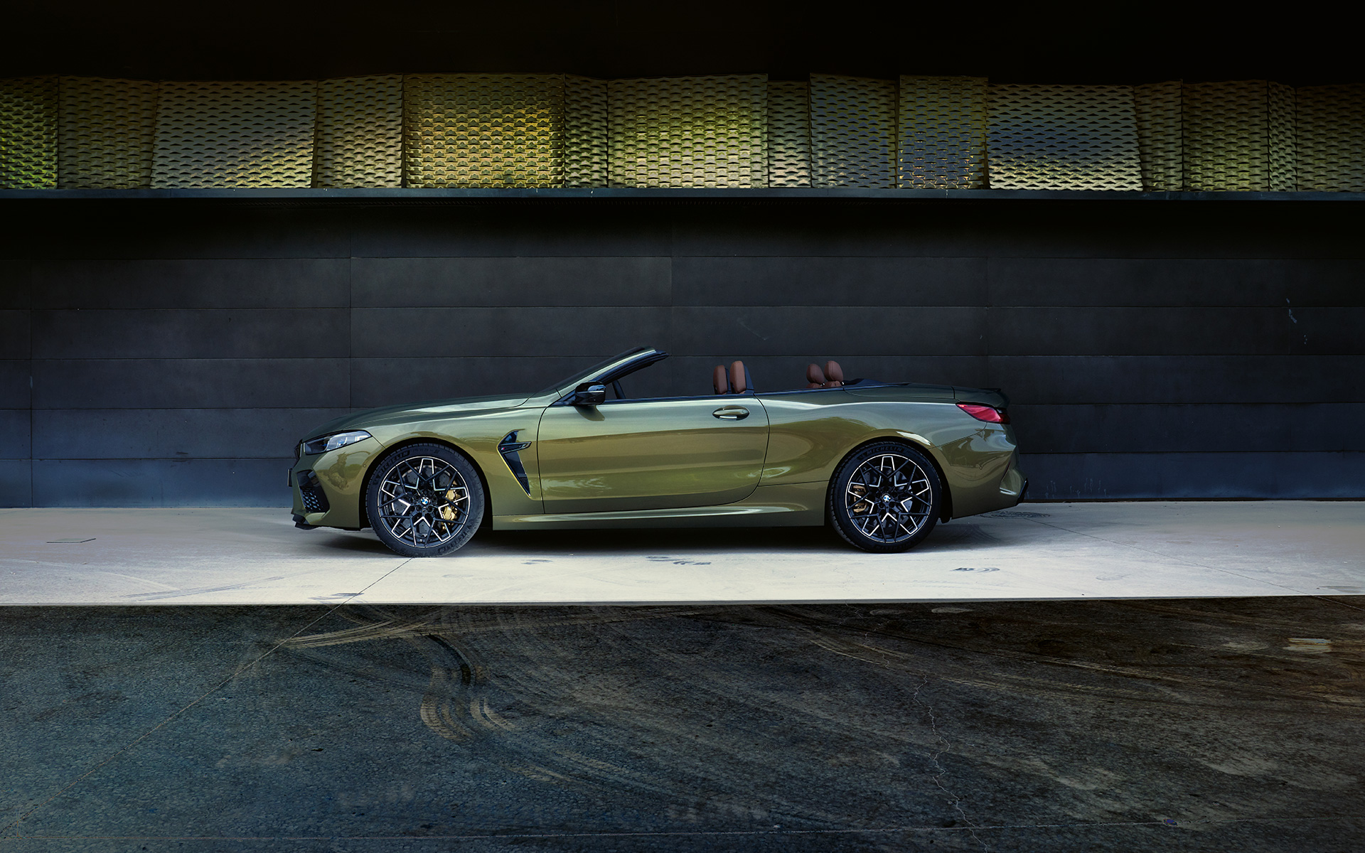 side view on stage BMW M8 Competition Convertible F91 LCI Facelift 2022 BMW M8 Competition Convertible F91 LCI Facelift 2022 BMW Individual Brass metallic side view on stage