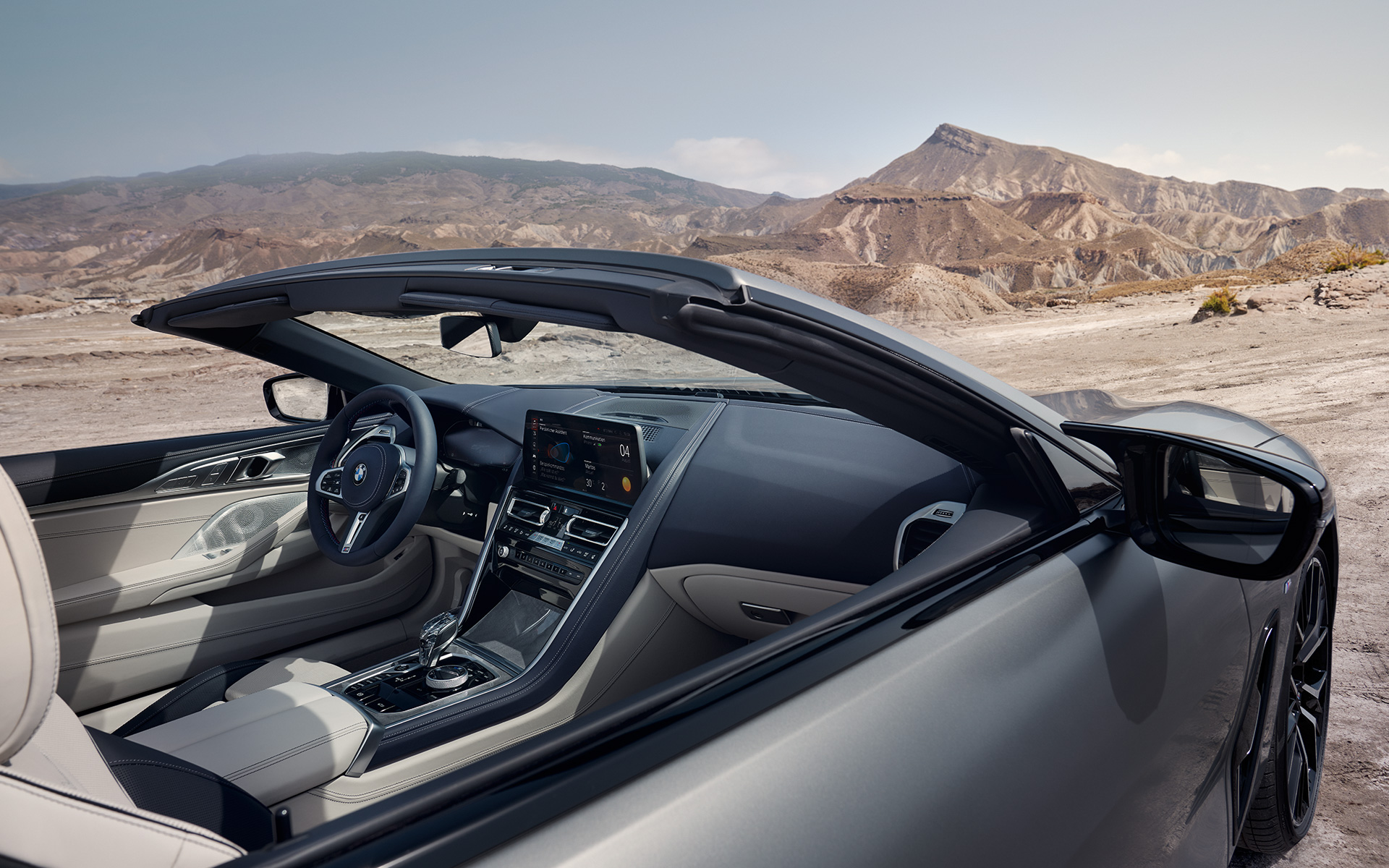 Interior BMW M850i xDrive Convertible G14 LCI Facelift 2022 BMW M850i xDrive Convertible G14 LCI Facelift 2022 BMW Individual Frozen Pure Grey metallic interior view through open top