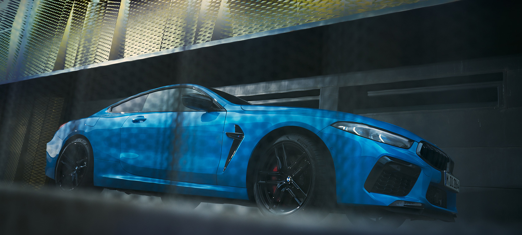 BMW M8 Competition Coupé F92 LCI Facelift 2022 side view standing low-angle shot BMW M8 Competition Coupé F92 LCI Facelift 2022 BMW Individual Daytona Beach Blue uni side view standing in front of a building low-angle shot
