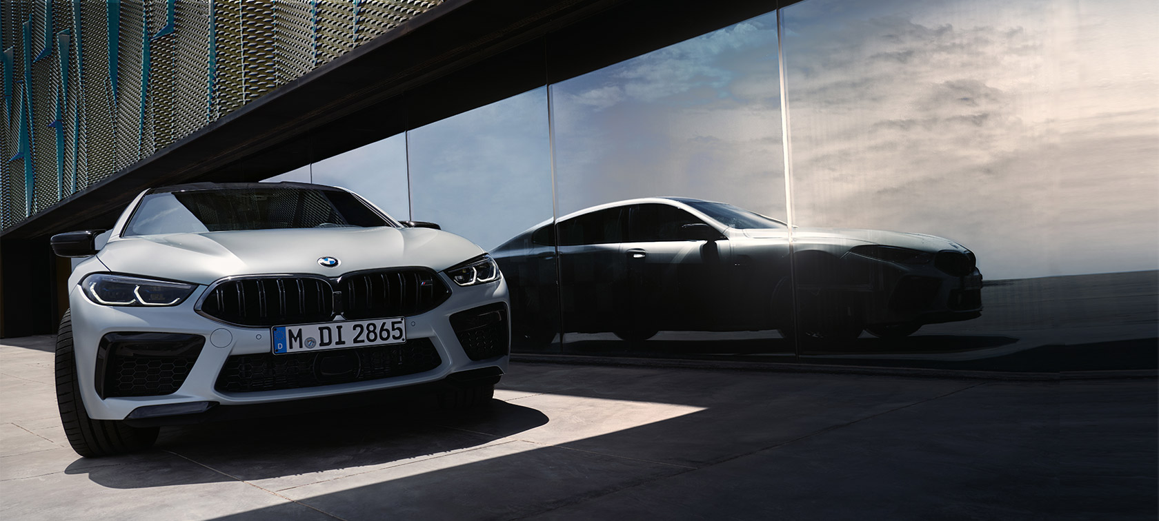 Front view BMW M8 Competition Gran Coupé F93 LCI Facelift 2022 BMW M8 Competition Gran Coupé F93 LCI Facelift 2022 BMW Individual BMW Individual Frozen Brilliant White metallic front view with reflection of silhouette on the window front