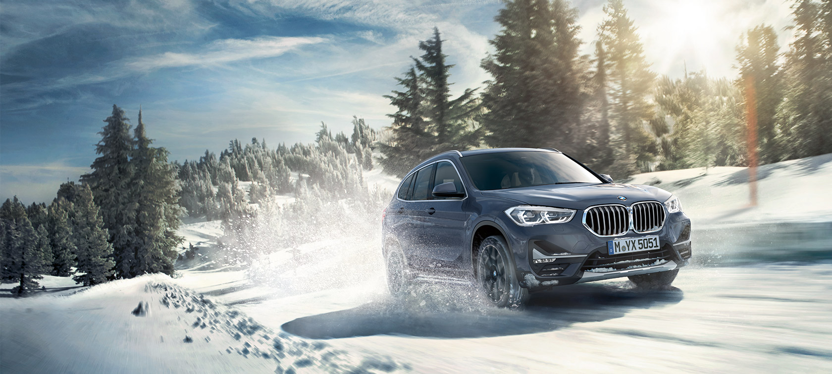 BMW X1 xDrive20i F48 LCI in BMW Individual Storm Bay metallic BMW X1 xDrive20i F48 LCI in BMW Individual Storm Baymetallic, driving in winter landscape