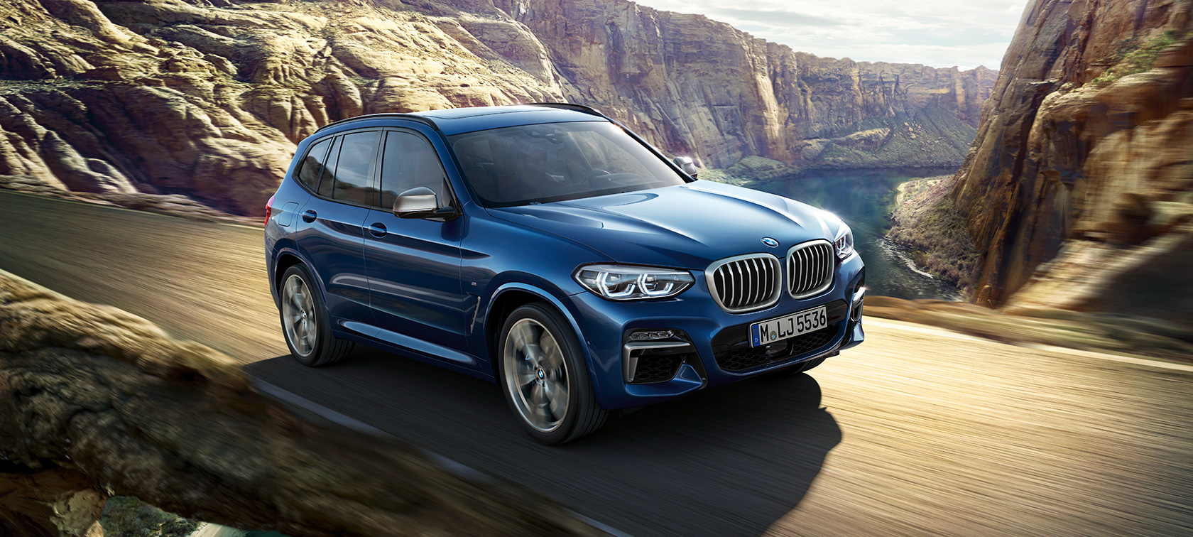 BMW X3 M40i, driving shot in fornt of canyon BMW X3 M40i, driving shot in fornt of canyon