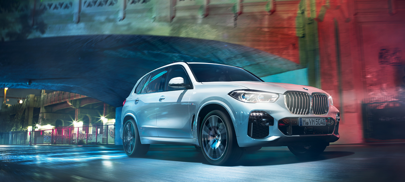 Bmw X5 Suv With Xdrive Ie The Bmw X5 Travelling Through City At Night
