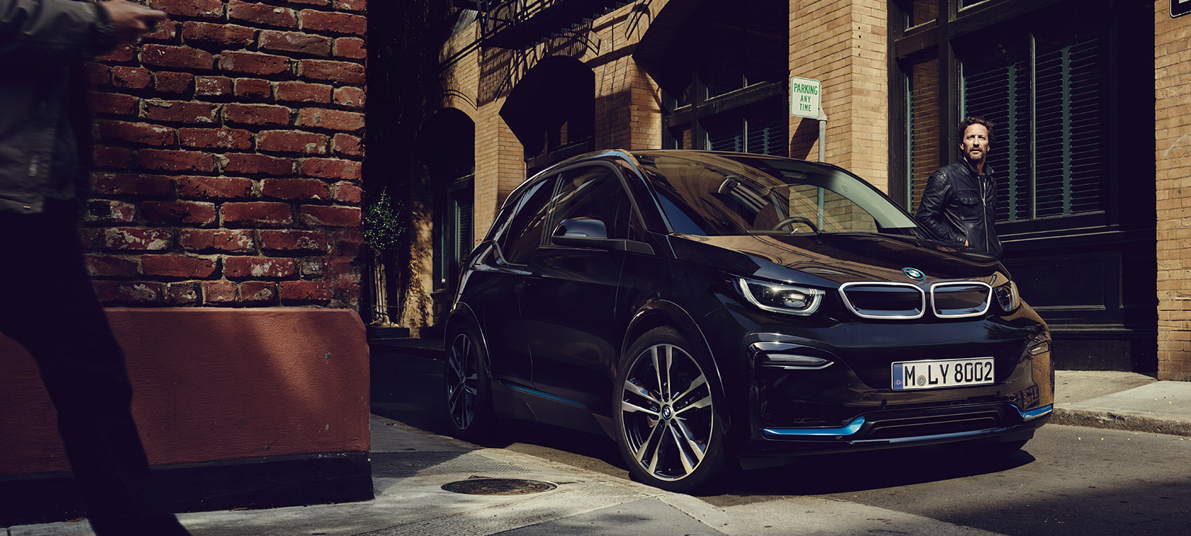 BMW i3. BMW i3 in three-quarter front in front of urban setting.
