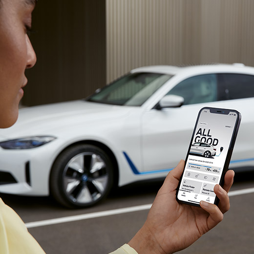 Connected Charging in the My BMW App BMW i4 G26 with person in the foreground