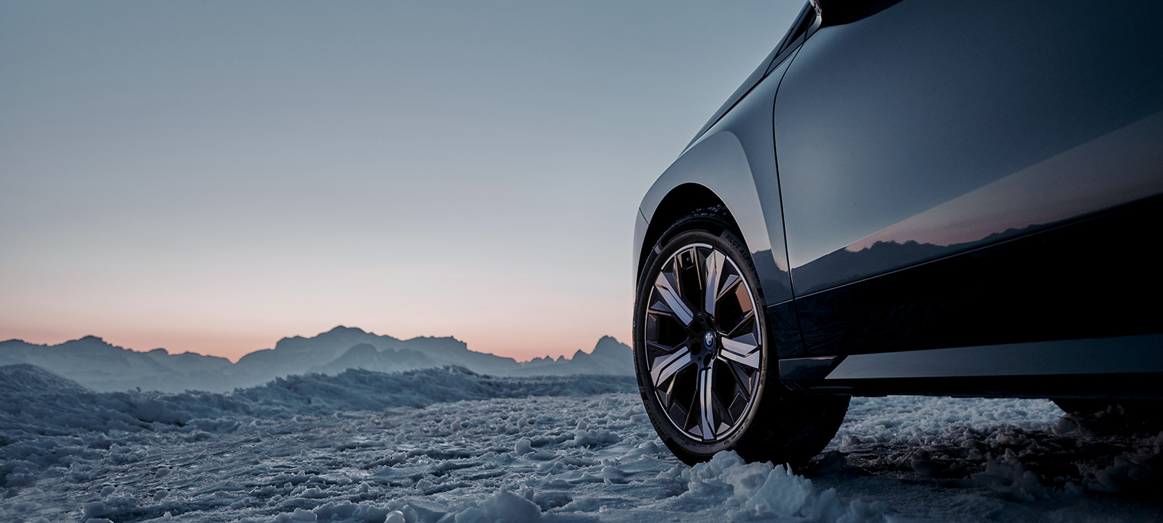 Original BMW Wheels on the BMW i4 (G26 BEV) on wet street Original BMW Wheels on the BMW i4 (G26 BEV) on wet street