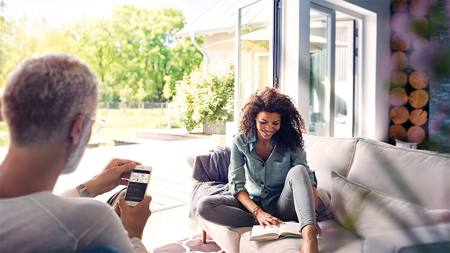 BMW Connected App Couple at home using BMW Connected App