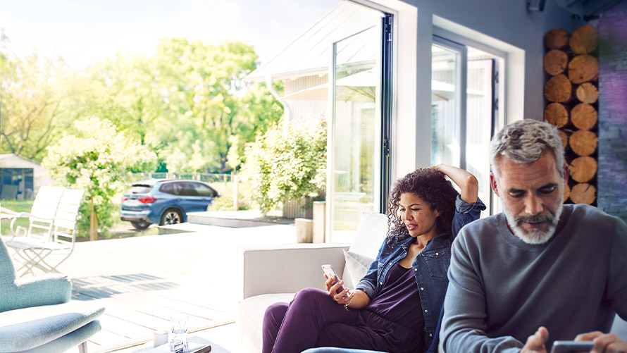 BMW Connected app Couple at home using BMW Connected app Remote Services