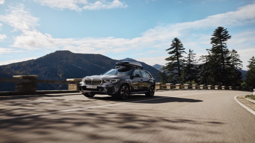 BMW cruising on a mountain road