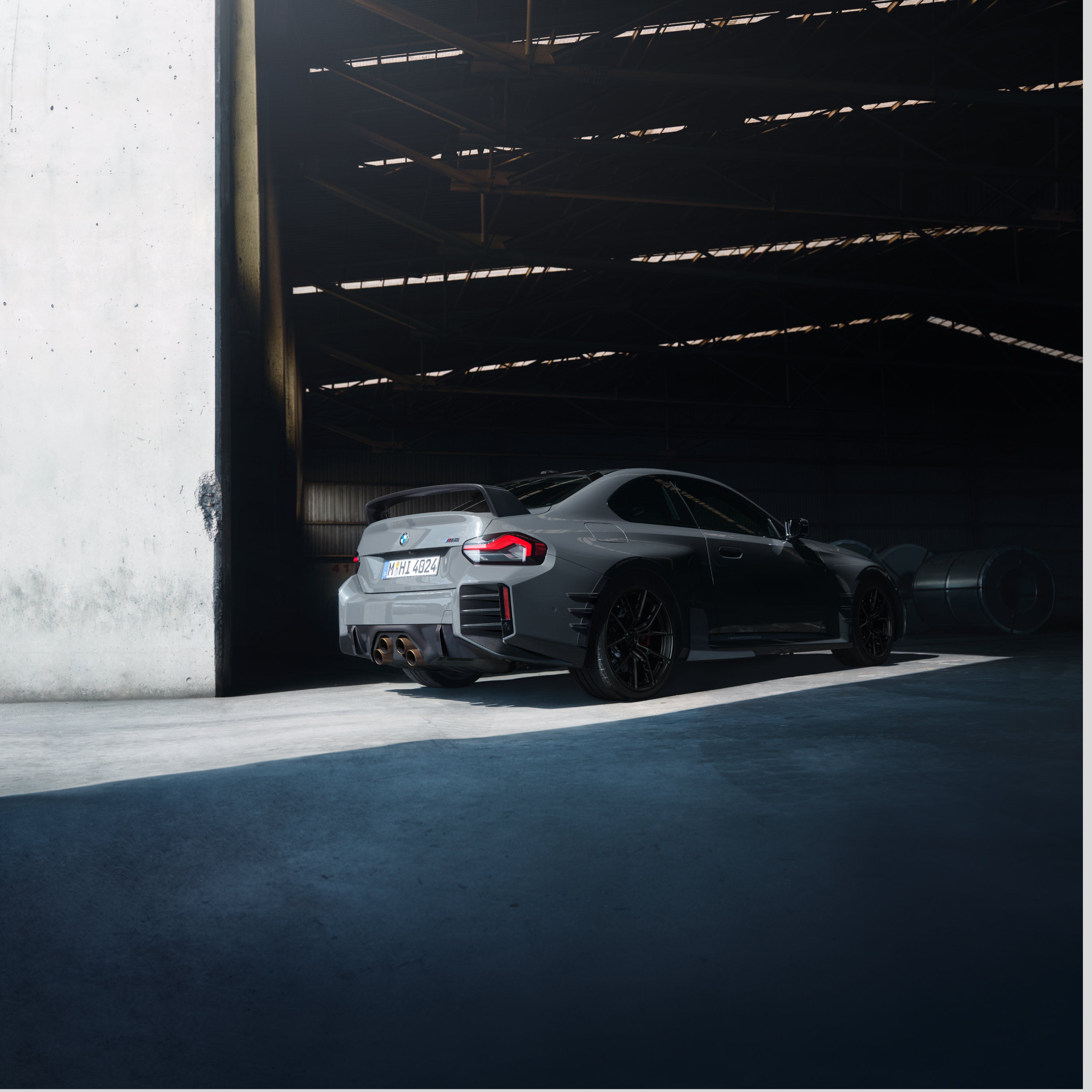 BMW at the gate of a large hall