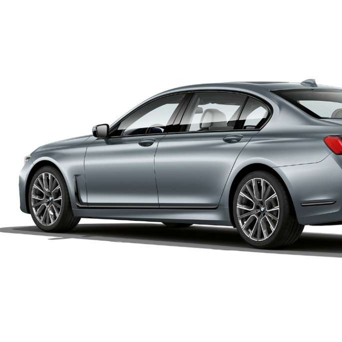 BMW 7 Series Saloon M Sport package, three-quarter rear view Grey BMW 7 Series Saloon M Sport package in three-quarter rear view